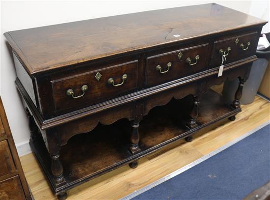 An 18th century oak dresser base, W.151cm